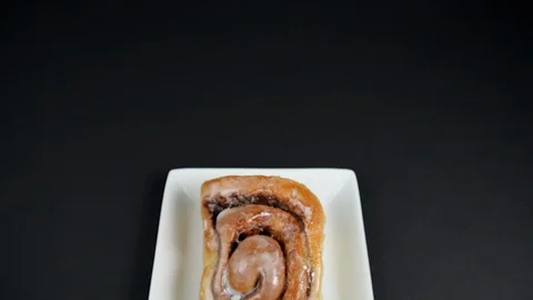 Close up of a delicious Cinnamon Roll on a plate. Stock Footage 104167679