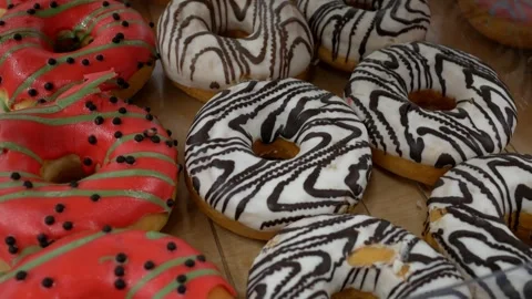 Close up delicious fresh donuts on a store window. Stock Footage 303631489