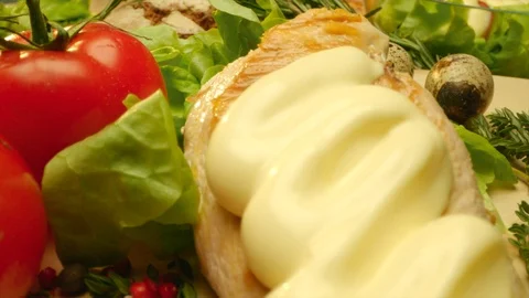 Close up delicious grilled chicken covered with mayonnaise with fresh greens and Stock Footage 107565843