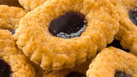 Close up of a delicious jam filled ring cookie Stock Photos