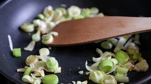 Close up of delicious leek on pan Stock Footage 74859685