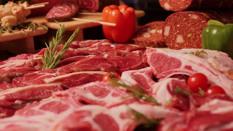 Close up delicious meat table layout raw steaks and sausages. Stock Footage 295269895