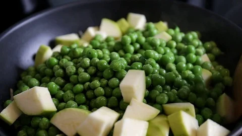 Close up of delicious peas and courgette Stock Footage 74860357