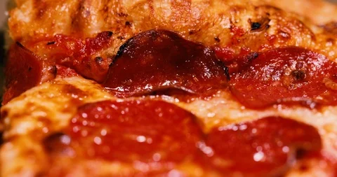 Close up of a delicious pepperoni pizza Stock Footage