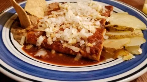 Close-up of delicious red enchiladas, typical mexican food Stock Photos