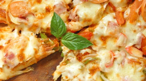 Close up a delicious slice of home bake ham cheese pizza Stock Footage 66609178