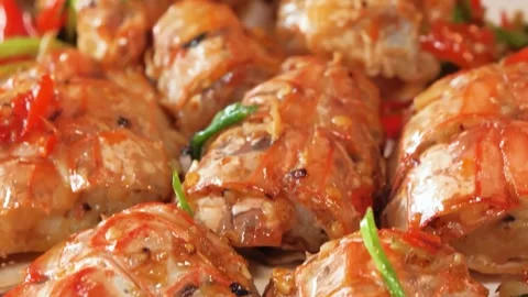 Close Up of Delicious Stir-Fried Mantis Shrimp in Savory Asian Chili Sauce Stock-Footage 344223611