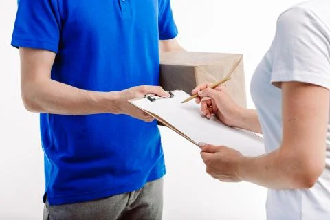 Close up of a delivery guy waiting for the client to recieve a shipment. Foto stock