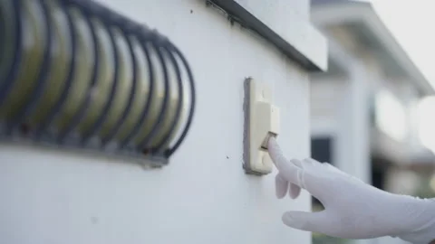 Close up a delivery man hand ringing the door bell for delivery. Stock Footage 213590785