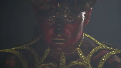 Close up of a demons look with her red creepy eyes in a smoky room Stock Footage 138139863