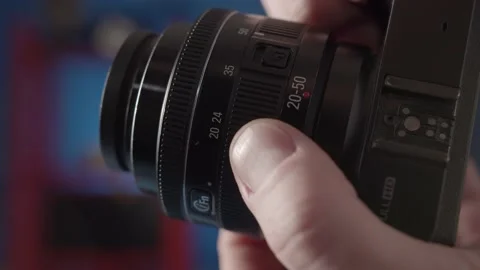 A close-up demonstration of the focus setting on the lens from the camera. Stock Footage 234541346