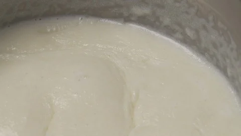 Close-up demonstration video of French bechamel sauce boiling. Haute cuisine. Stock Footage 126166329
