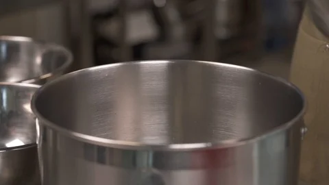 A close-up demonstration video of a highly professional baker placing a dough to Stock Footage 106247154