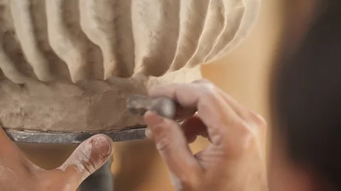 Close-up demonstration video of potters hands marking crafted clay pot. Stock Footage 113081459