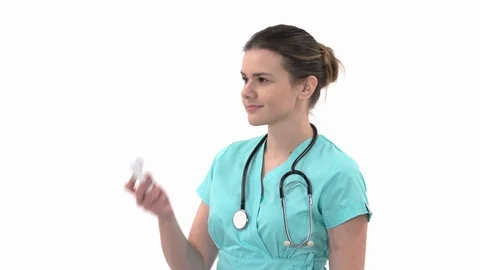 Close-up demonstration video of a young physician measuring her body temperature Stock Footage 121556980