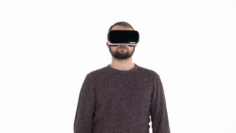 Close-up demonstration of a young bearded man using VR glasses. Virtual reality Video stock 121193762