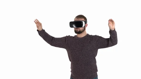 Close-up demonstration of a young bearded man in VR glasses imitates orchestra Stock-Footage 121201203