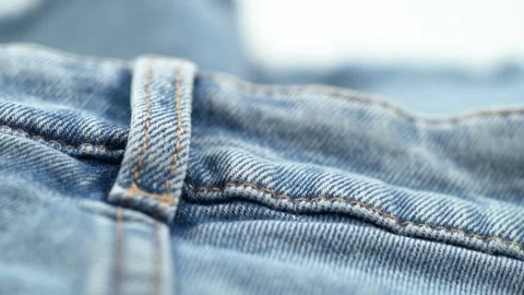 Close up of denim belt loop and stitching detail on jeans Stock Footage 331694926