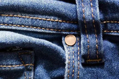 Close-Up Denim Texture with Button and Stitching Stock Photos