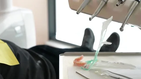Close-Up Dental Procedure with Tools and Dental Mold Видео 332898202