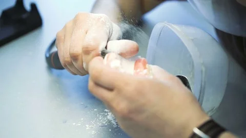 Close up of a dental technician making model of jaw in dental lab 4K Stock Footage