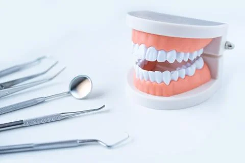 Close up dentist  tools for teeth care at white background top view Stock Photos