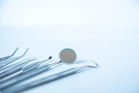 Close up dentist  tools for teeth care at white background top view Stock Photos