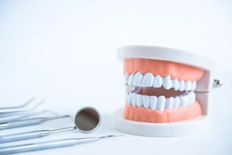 Close up dentist  tools for teeth care at white background top view Stock Photos