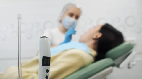 Close-up of the dentists hand treating teeth of a little girl in clinic. Stock Footage 317295917