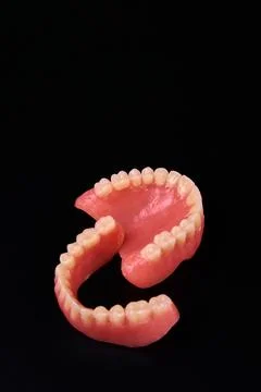 A close up of a denture on a black background for macro photography 写真素材
