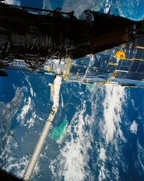 A close up deploy view of the Hubble Space Telescope on the end of the spac.. Stock Photos