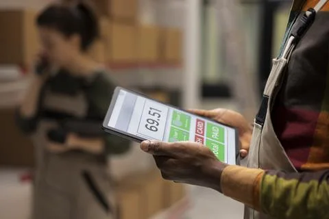 Close up of depot employee checking inventory and preparing parcels for delivery Stock Photos