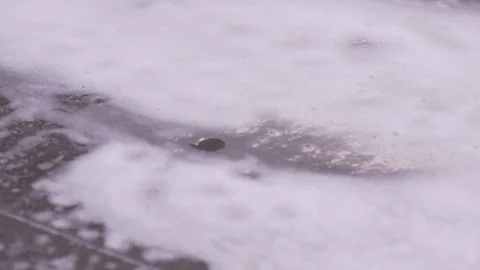 Close Up Depth Of Field Soap Puddle On Floor Stock Footage 87895339