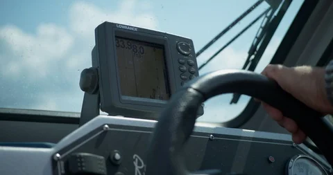 Close up of depth finder or fish finder with GPS on fishing boat with hand Stock Footage 111363120