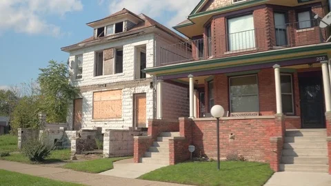 CLOSE UP Derelict decaying home next to beautiful semi-detached house in Detroit Stock Footage 76718040