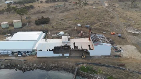 Close-up of a derelict industrial building with a collapsing roof and chimney. Stock-Footage 332542689