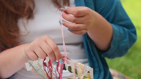 Close Up Of Designer Picking Embroidery Thread With Colorful Strings Stock Footage 322659058