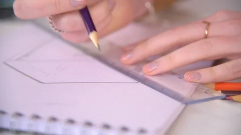 Close on designer using ruler in technical drawing Stock Footage 124183218