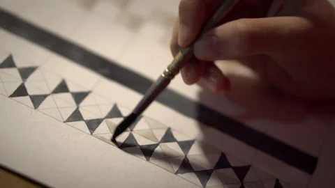 Close-up.The designer is working on a project, the girl draws a pattern Stock Footage 148290322