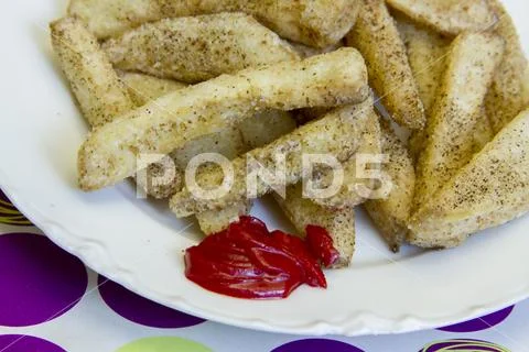Close up dessert imposter apple fries with icing ketchup Stock Photos