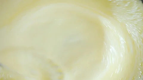 Close-up of dessert preparation. Chef mixing egg yolk and sugar mixture. Video stock 309296297