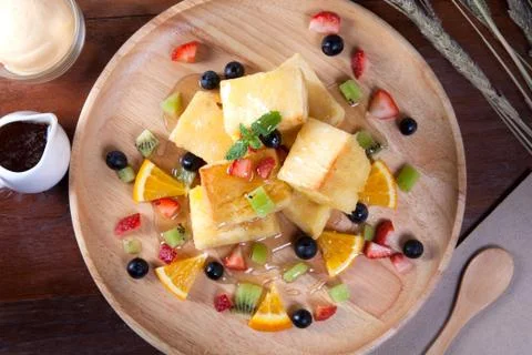 Close up of dessert which has Bread, strawberry berries, blueberries, kiwi, o Stock Photos