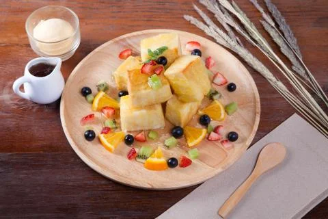 Close up of dessert which has Bread, strawberry berries, blueberries, kiwi, o Stock Photos