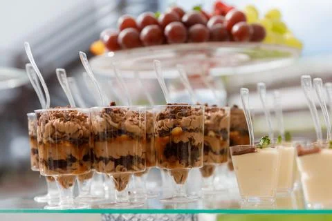 Close up of desserts on tray on table Stock Photos