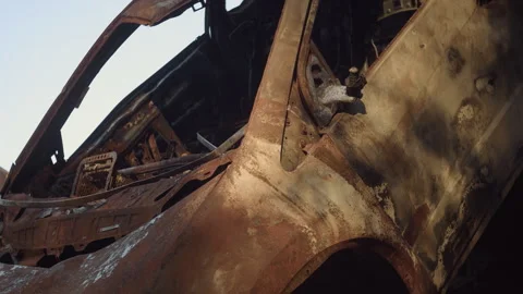 Close-up of destroyed burned car in Irpin Stock Footage 253224134