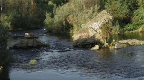 Close up of Destroyed concrete bridge fallen in river in Fresno California Stock Footage 64796453