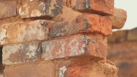 Close-up of a destroyed red brick chimney, the remains of a burnt house. Stock Footage 224679824