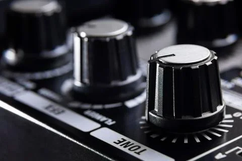 Close-up detail of the adjustment knobs in the panel of an electric guitar am Stock Photos