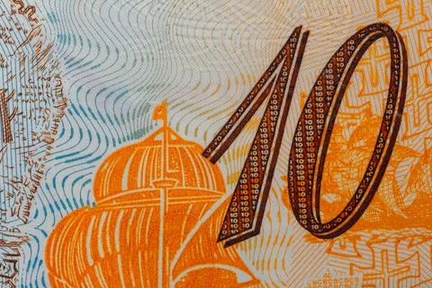 Close-up detail of currency security feature showing number ten Stock Photos