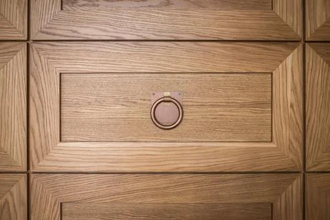 Close-up detail of a decorative wall in the form of many panels of drawers with Stock Photos